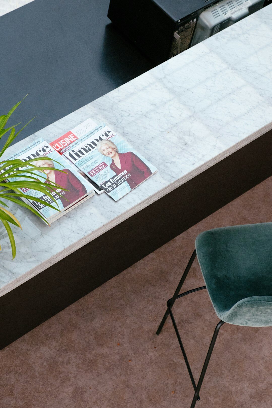 Elegant editorial desk workspace with design boards and photographs